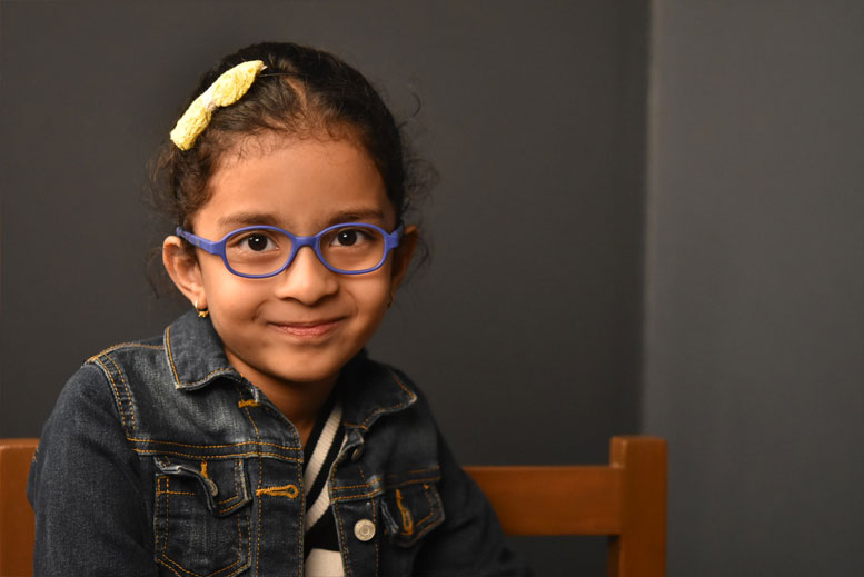 child with glasses